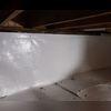 With the floor covering and wall covering in place, the spray foam will be applied next to seal it all up.