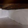 With the floor covering and wall covering in place, the spray foam will be applied next to seal it all up.