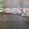 After the helical piers were installed, the crew backfilled the soil around the foundation of the home