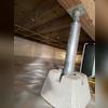SmartJack support post installed to stabilize the failing floor joists