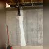 To prevent water getting into a basement through the foundation crack, we ground and prepped the wall for the injection, after that we installed injection ports, and injected the crack with epoxy. This includes a second visit to cut off injection ports, seal ports, and reseal the surface of the...