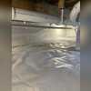 In order to trap vapors, and control humidity levels, we installed a CleanSpace vapor barrier across the dirt crawlspace and up the exterior walls. Material were fastened mechanically at the top of the exterior walls and sealed with a urethane. We then installed an AprilAire Dehumidifier to...