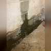 In order to correct this bowing foundation wall, we installed six Fortress Carbon Fiber Straps on the south wall of the basement.  We ground the wall surface to prepare for the initial epoxy layer.  We then used hydraulic cement to patch a small area at the bottom that had sheared and attached neck...