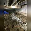 To begin to combat the water and mold issues in this crawlspace, we sprayed Mold-X, mold neutralizer on all the organic materials in the crawlspace.

We then dug around the perimeter of the crawlspace to install drainage stone with 4 inch drain tile and dug down to set the basin for our Supersump...