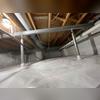 Our SmartJack support posts stabilize the crawl space floors joists