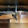 Looking at this image we can see we fully encapsulated all the ducts and buried them in our TruSoft cellulose insulation.  We used tape and mastic to code, spray foamed the ducts, encapsulated the metal ducts by installing our SiverGlo insulation boards, used our orange ZypFoam sealant to air seal...