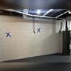 The crew marked the different areas along the basement walls where they would be installing Carbon Armor Straps.