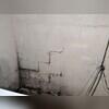 This wet and humid basement was experiencing mold growth and foundation failure due to the prolonged exposure of excess moisture within the area.