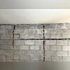 The weight of the soil behind the walls was too great to be held back by the foundation wall. As a result, the wall began to bow inward and crack.