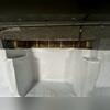 After sealing the vents in the crawl space, the crew permanently fastened our CleanSpace Vapor Barrier System to the walls in the crawl space
