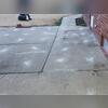 The slabs of this patio have been lifted back up to their original position.