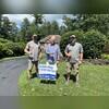 Colby and Matt posing with the customer in his front yard after a job well done!