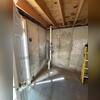 Strategically placed pipes for optimal radon extraction.