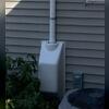 A robust radon fan was placed outside the home to actively draw radon from beneath the foundation and vent it safely away from the house.