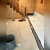 Once systems are in place, CleanSpace Vapor Barrier is installed over the wall and floor to prevent water from leaking through. Instead, it drains down the back side of the liner and into the drainage system.