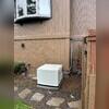 The generator is installed on a flat surface and the lines are all hooked up