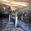 SmartJack posts are installed by first excavating small holes in the crawl space floor, then placing a pre-cast concrete base at the bottom of each hole. The steel posts are then positioned on these bases and adjusted to provide the necessary support and lift to the sagging floors above.