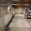 Our WaterGuard subfloor drainage system has service ports in case we need to take a look inside the system. You can see the port near the bottom left of the picture.