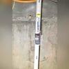 The manometer reading at 2.0 confirms the system's effectiveness in reducing radon levels.