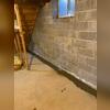WaterGuard was installed below the floor slab to drain the water seeping in from the walls toward the sump pump.
