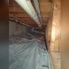 One section of the crawlspace encapsulation. The pipe along the top is running towards the back outside corner of the house where the fan will be located.