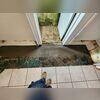We installed a trench drain in the doorway to the stairwell. We install the trench drain inside the basement so leaves can't clog it.