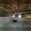 Our crew encapsulated the crawl space around the basement's existing sump pump for a seamless fit.