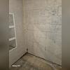 The damp basement before the waterproofing project.