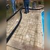 Concrete injections lifting pool deck.