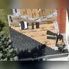 The guys are working their way up on of the front slopes of the house