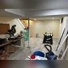 Observe the water damage depicted in the photo. Accumulation of water beneath the flooring led to mold growth, resulting in damage to personal items due to basement flooding.