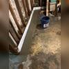 WaterGuard was installed under the footer and against the wall to capture moisture coming through the basement walls and direct it to the sump pump.