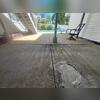 A substantial void beneath the concrete slab resulted in the slab sinking, thereby creating a trip hazard.