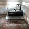 CleanSpace lines the basement walls and it is strong a vapor barrier. In this basement, it was also placed beneath the oil tanks to protect them. The WaterGuard is installed along the floor's perimeter and around the oil tank to further protect them from water.