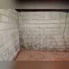 This wall crack was extremely severe and posed a serious threat to the home's foundation.