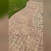 The sidewalk is sinking and needs a strong system to restore it.