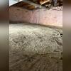 A thin concrete floor sits over the dirt beneath it. Fiberglass, or blanket-wrap, insulation is on the walls. This type of insulation on foundation walls is one of the worst things you can have in a basement or crawl space!