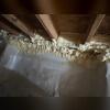 RimTite Joist Insulation Spray Foam is used as an extra layer of insulation between the floor joists.