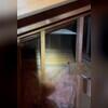The crew extracts the old, rolled insulation to work with a clean slate.