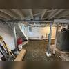 Here you can see our crew has covered a good portion of the basement with our CleanSpace Wall System. They also jackhammered all the old concrete away to make way for the new floor to be poured.