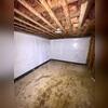 CleanSpace Vapor Barrier was fastened to the basement wall to prevent and block moisture from seeping through. Instead, the moisture will drain down the back side of the liner, directly into the drainage system to be removed from the basement through the sump system.