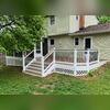 From this side, you can see the crisp white Drinktop vinyl railings, vinyl lattice skirting, and the seamless transition between the open deck and screened porch. Built to be low-maintenance and built to last.