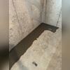 Once the system is in place, the team re-concretes the floor so the pipes are hidden.