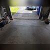 The concrete adjacent to the garage apron had begun to settle, creating an unsightly appearance and raising concerns about vehicle access. This settlement is evidenced by cracks in the foundation floor, which, if not promptly addressed, could deteriorate further over time.