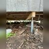 Our team installed a series of Helical Piers and SmartJacks to stabilize and support the failing floor system. These systems work together to transfer the load to stable soil and lift the floor back toward its original level.