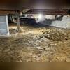 When our Solution Specialist arrived, he had to slide around in the mud crawl space.
