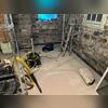The damp basement before the waterproofing project.