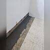 The pipes are laid along the perimeter of the water to catch any water leakage.