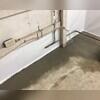 WaterGuard is installed along the perimeter of the basement floor and covered in fresh concrete to provide a seamless finished look. The WaterGuard Port is left visible to provide access to the system when needed.
