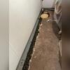 WaterGuard was installed under the floor slab and against the wall to collect any water seepage from the wall to direct towards the sump pump.